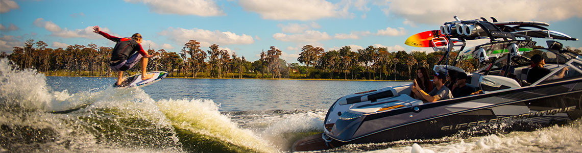 Wakeboarder catching air on a wake